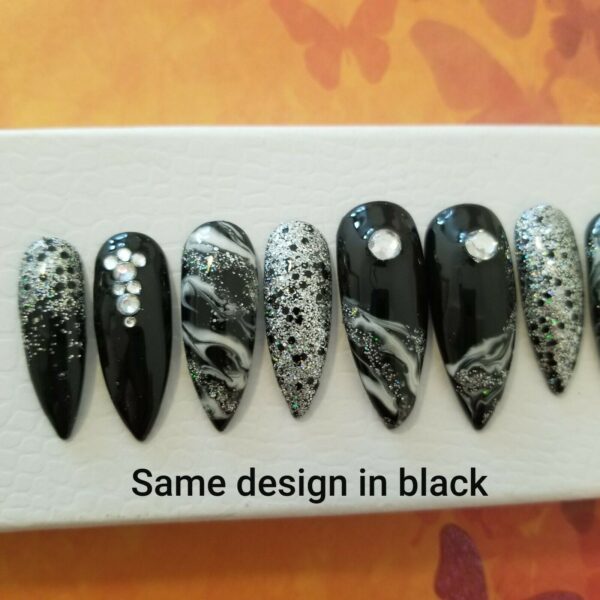 stiletto nails with black and white nail art